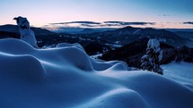 Blue sunrise morning over wild winter mountains nature with frozen snowy forest landscape Time lapse
