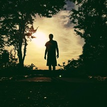 Man outdoors at sunset