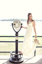 Bride standing in front of binoculars