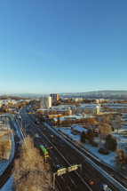 aerial view over a city with a dusting of snow 