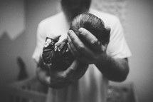 father holding a newborn 