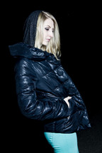 woman standing in a black winter coat