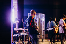 musicians performing on stage during a worship service 