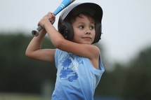 A boy ready to swing a baseball bat