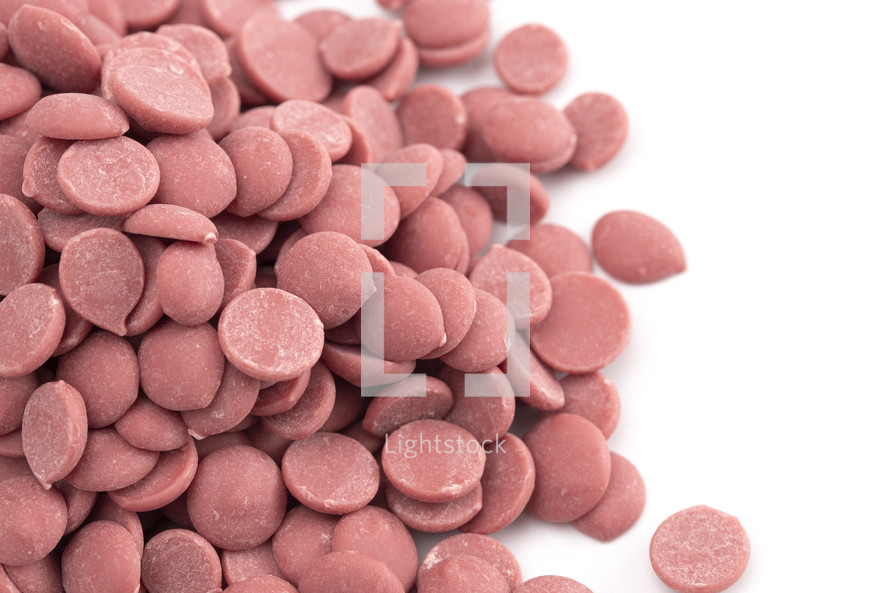 Authentic Ruby Chocolate Drops on a white Counter