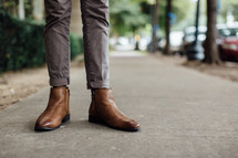 boots on a sidewalk 