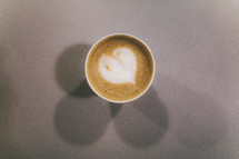 heart shape in creamer in a coffee mug 