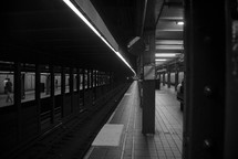 passengers at a subway station 