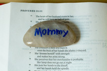 mommy stone on the pages of a Bible 