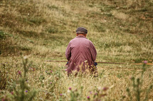 Man walking in a meadow.