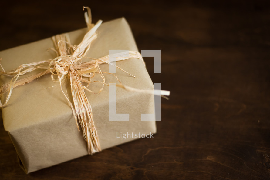 wrapped Christmas gift in brown paper 