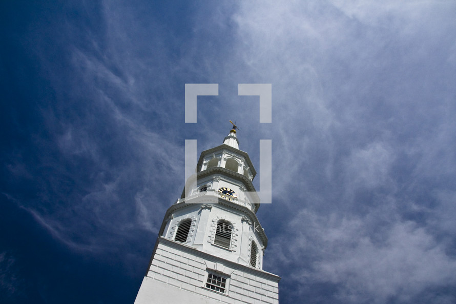 white church steeple and a cobalt blue sky