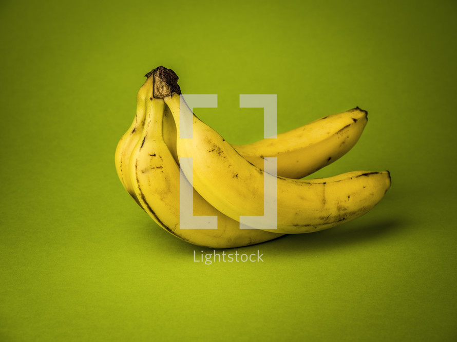 bananas against a green background 