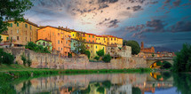 Old italian city Umbertide near Tevere river with cloudy sunset light