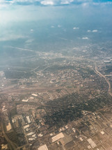 aerial view over city below 