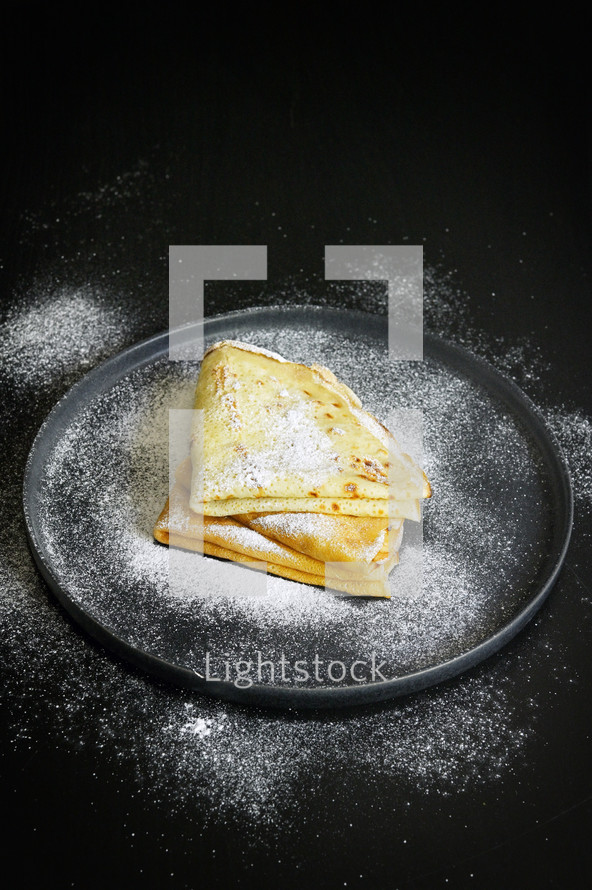 Breakfast Pancakes with Sugar on Black Background