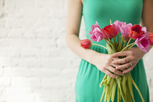 woman holding tulips 