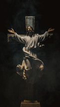 Crucifix on a black background with smoke