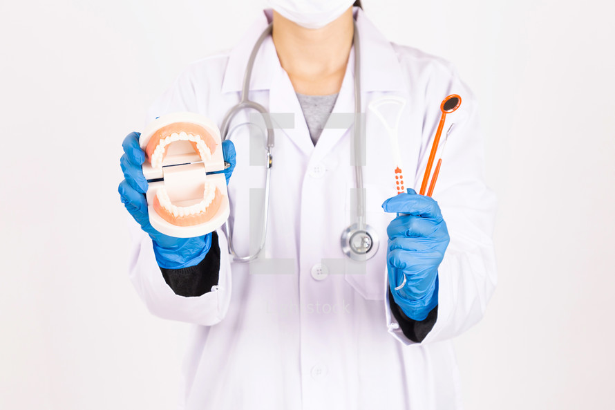 dentist holding medical tools 