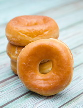 stacked donuts on a wood background 