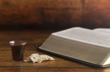 communion elements and an open Bible 
