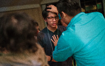 a teen boy receiving a blessing 