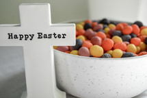 bowl of candy and cross with words Happy Easter 