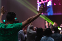 hands raised at a worship conference 