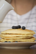 stack of pancakes and blueberries 