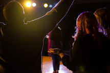 man and woman during a worship service