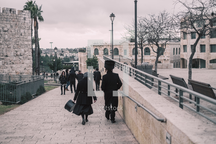 people walking on sidewalks in Jerusalem 