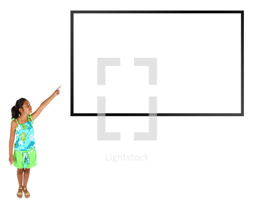Little girl pointing with the finger on white background