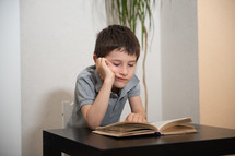 boy reading a book 