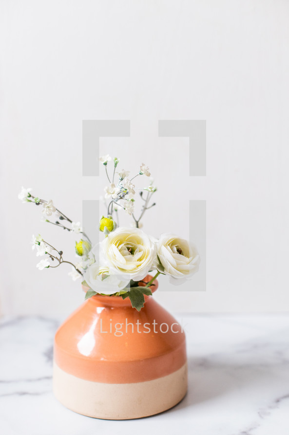 flowers in a clay vase 
