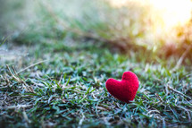 red felt heart on a lawn 