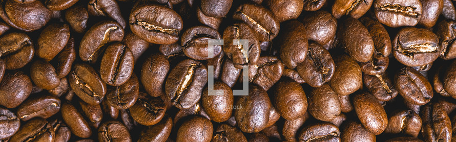 Background from coffee beans from above.