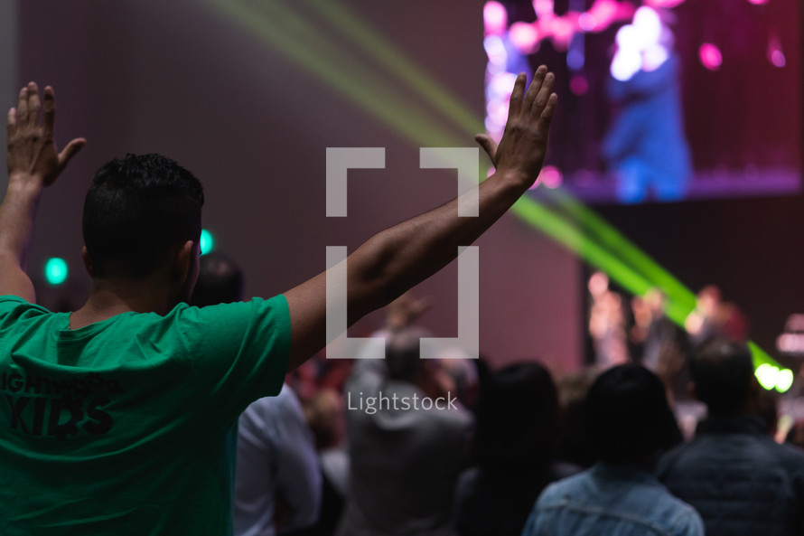 hands raised at a worship conference 