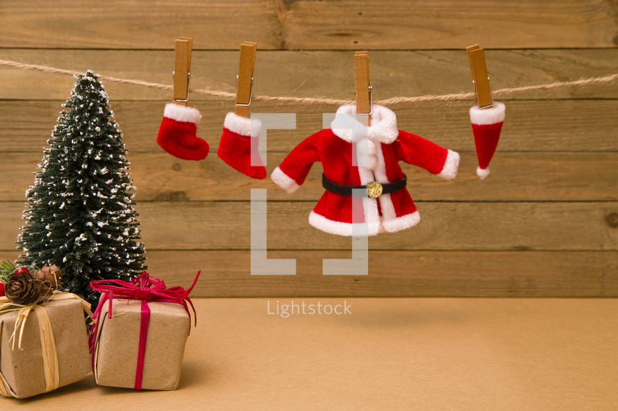 Christmas stockings and Santa suit on a clothesline 