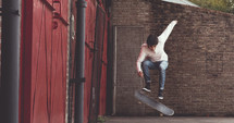 young man doing tricks on a skateboard 