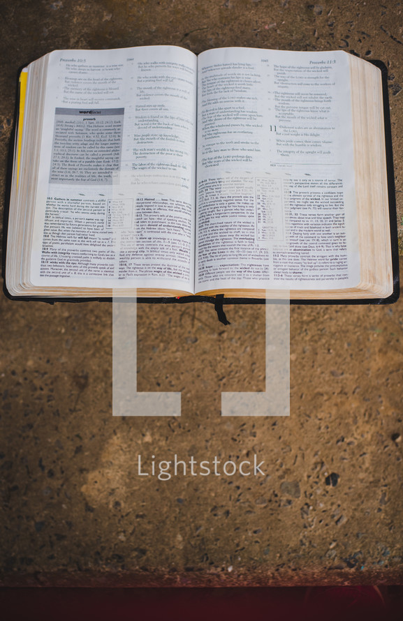 open Bible on a concrete 