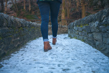 a woman hiking on a path 