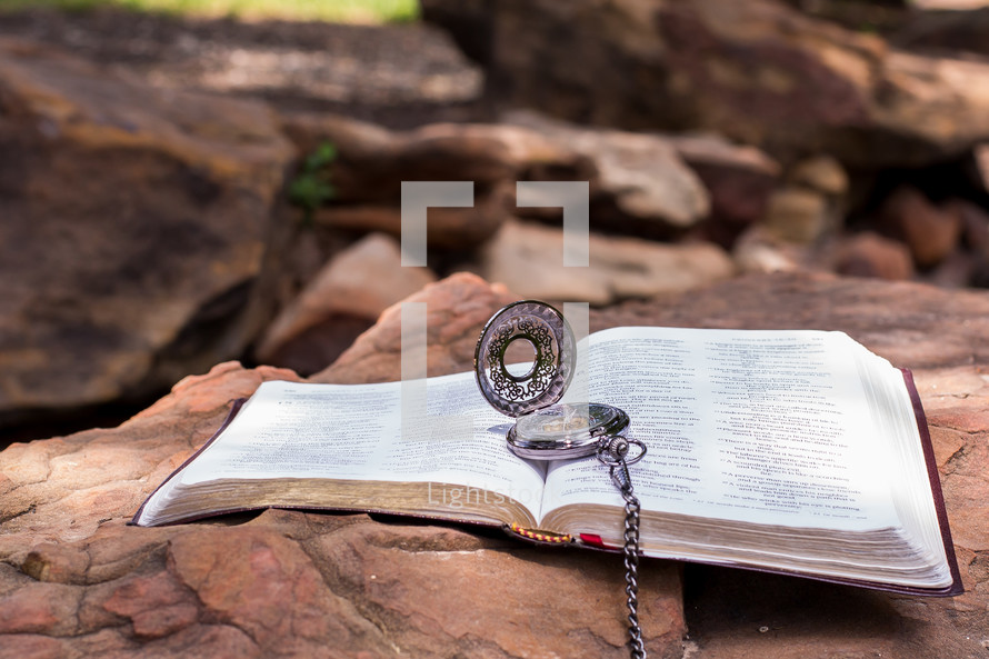 compass on an open Bible 