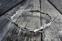 a crown of thorns on wood boards 