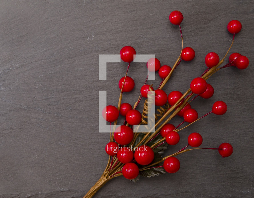 red berry decoration on slate 