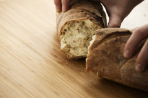 A woman breaking bread