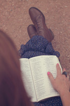 woman reading a Bible in her lap 