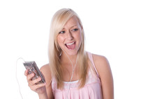 a young woman listening with earbuds to music 