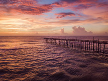 rustic pier at sunset 