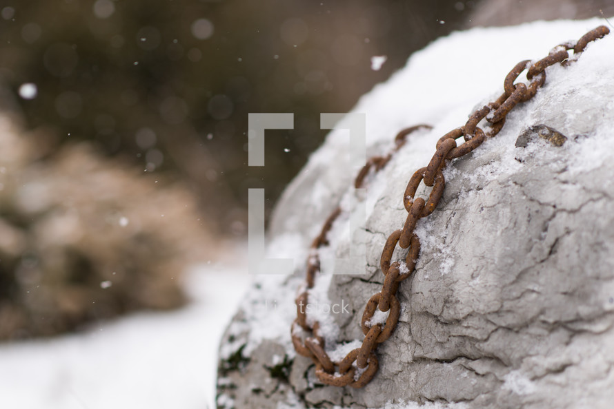 rusty chain in snow 