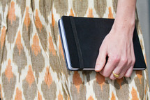 woman holding a journal 